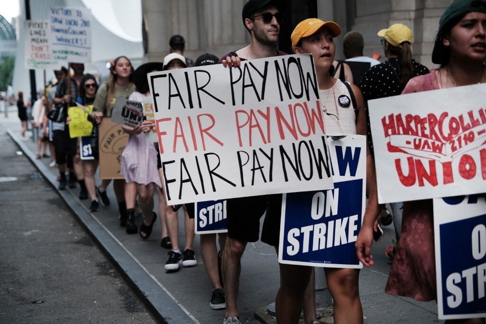 HarperCollins workers picket outside the publishing houses offices in Manhattan.