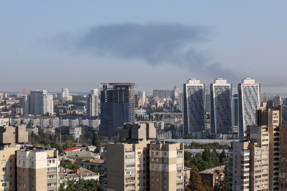 Explosions were heard in Kyiv, where many people rushed to shelter in subway stations.