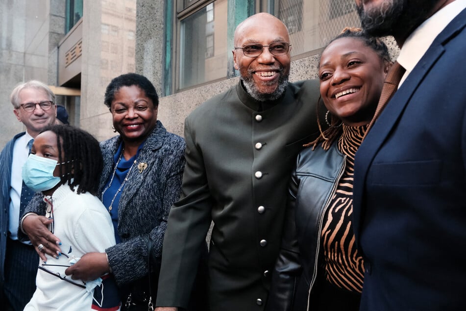 Muhammad Aziz stands outside of a New York City courthouse with members of his family and lawyers after his conviction in the killing of Malcolm X was thrown out on November 18, 2021 in New York City.