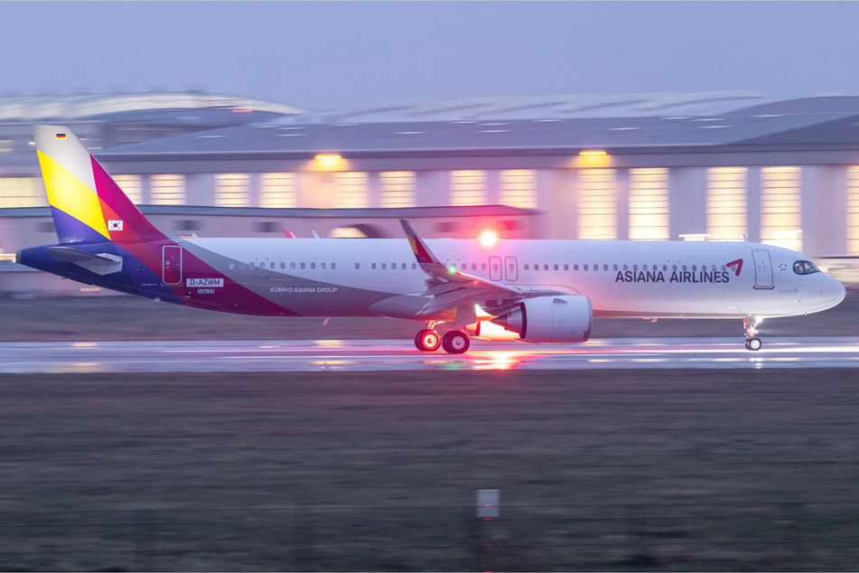 A man was arrested after he opened the emergency exit door during an Asiana Airlines flight, causing a dozen people to be injured (file photo).