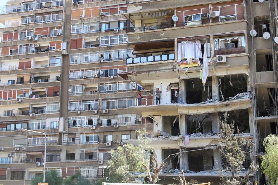 A damaged building is seen in the aftermath of an Israeli strike in the Mezzah suburb, west of the Syrian capital of Damascus.