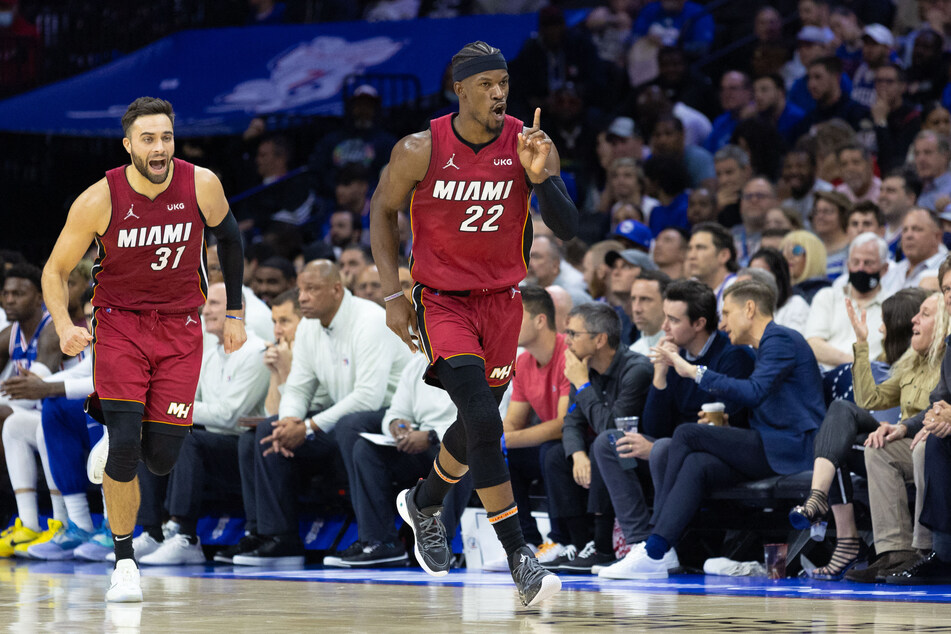 Jimmy Butler (r.) top-scored as the Heat bounced the Sixers out of the playoffs.