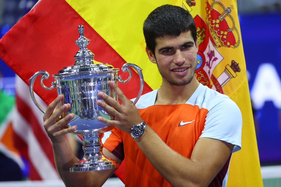 Spain's Carlos Alcaraz celebrates with his trophy after winning the 2022 US Open.