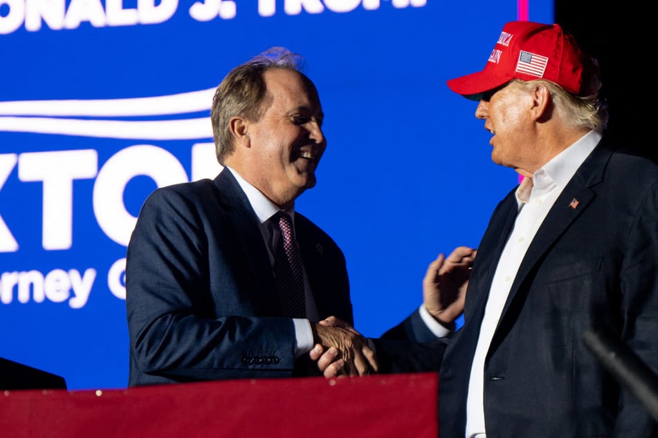 Donald Trump (r) congratulated Ken Paxton on his acquittal via Truth Social on Satruday.