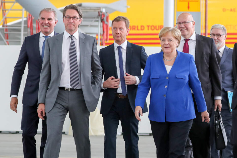 Besuchten die erste Nationale Luftfahrtkonferenz auf dem Flughafen Leipzig-Halle (v.l.n.r.): Carsten Spohr, Lufthansa-Vorstandsvorsitzender, Bundesverkehrsminister Andreas Scheuer (CSU), Sachsens Ministerpräsident Michael Kretschmer (CDU), Bundeskanzlerin