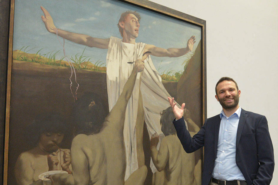 Dr. Stephan Dahme vor dem Gemälde "Die Erziehung Alexanders".
