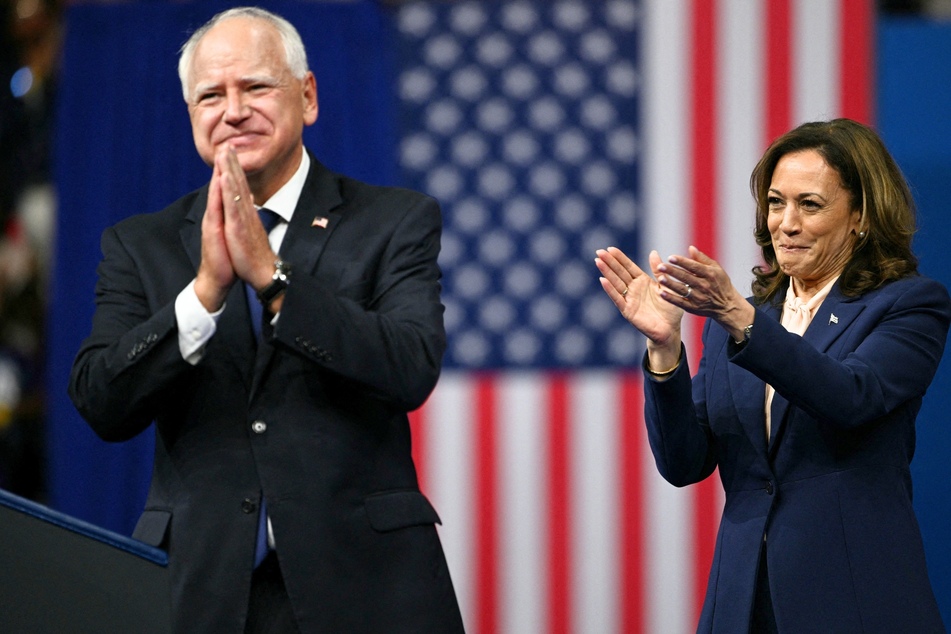 Kamala Harris (r.) and her running mate Tim Walz (l.) during a campaign event at Temple University's Liacouras Center in Philadelphia, Pennsylvania on August 6, 2024.