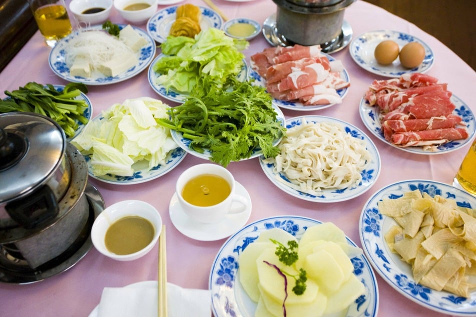 Hotpot involves cooking raw meat and vegetables in broth.