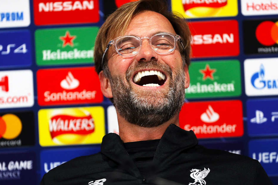 Da bleckt er seine strahlend weißen Zähne: Liverpool-Coach Jürgen Klopp machte Witze über die Entstehung einer möglichen Superliga.