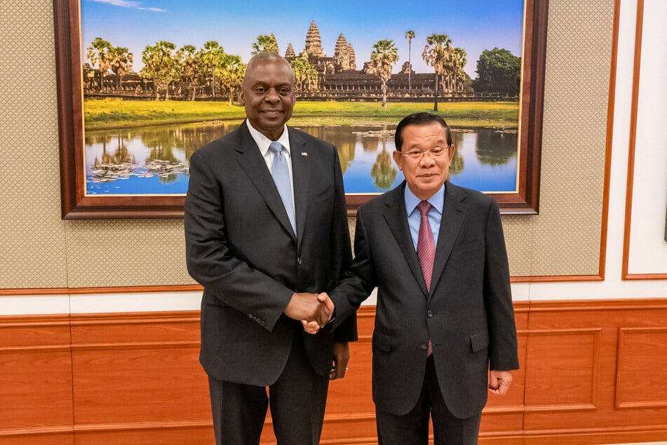 US Defense Secretary Lloyd Austin shakes hands with the president of the Cambodian Senate Hun Sen during their meeting in Phnom Penh.