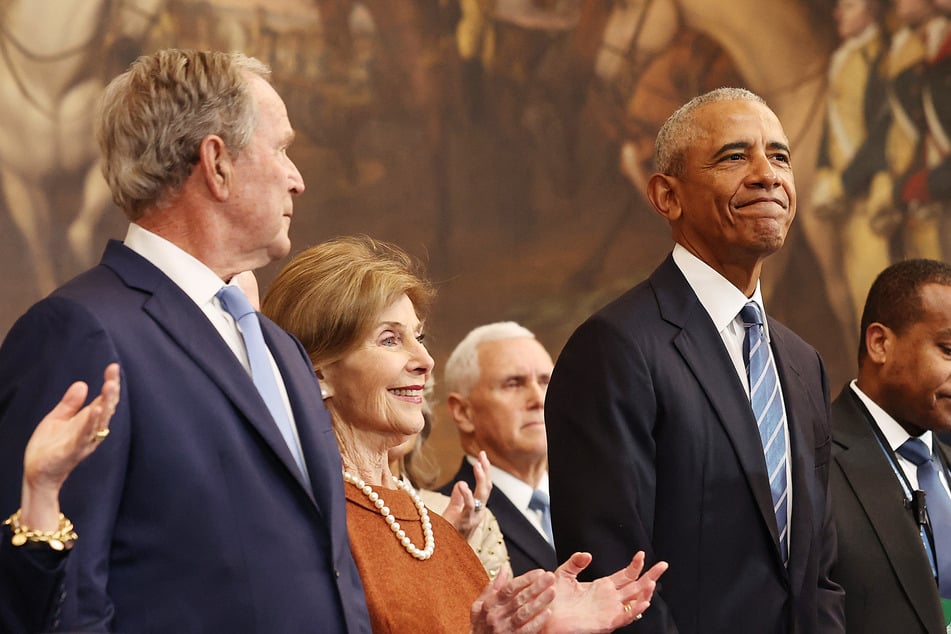 Former-presidents Barack Obama and George W. Bush shared a short exchange during Trump's inauguration on Monday.