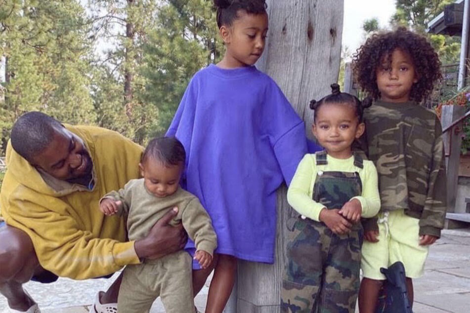 Kim shared a shot on her IG Story of Kanye West (l.) with his four children (from l. to r.): Psalm, North, Chicago, and Saint West.