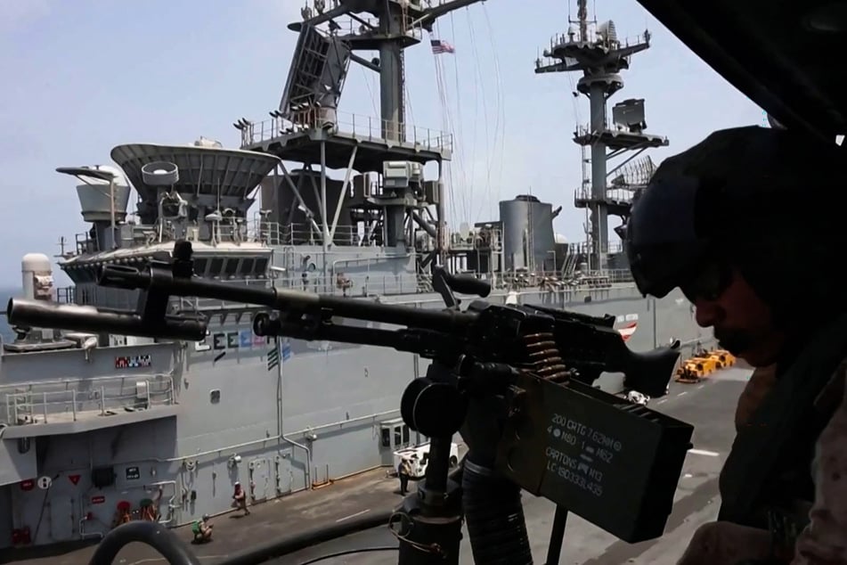 A US soldier mans machine gun aboard a Navy ship enforcing the US' blockade of Iran.