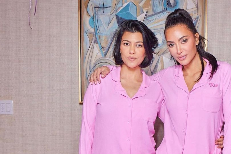 Kourtney and Kim Kardashian twin in pink onesies as feud plays out in season 3