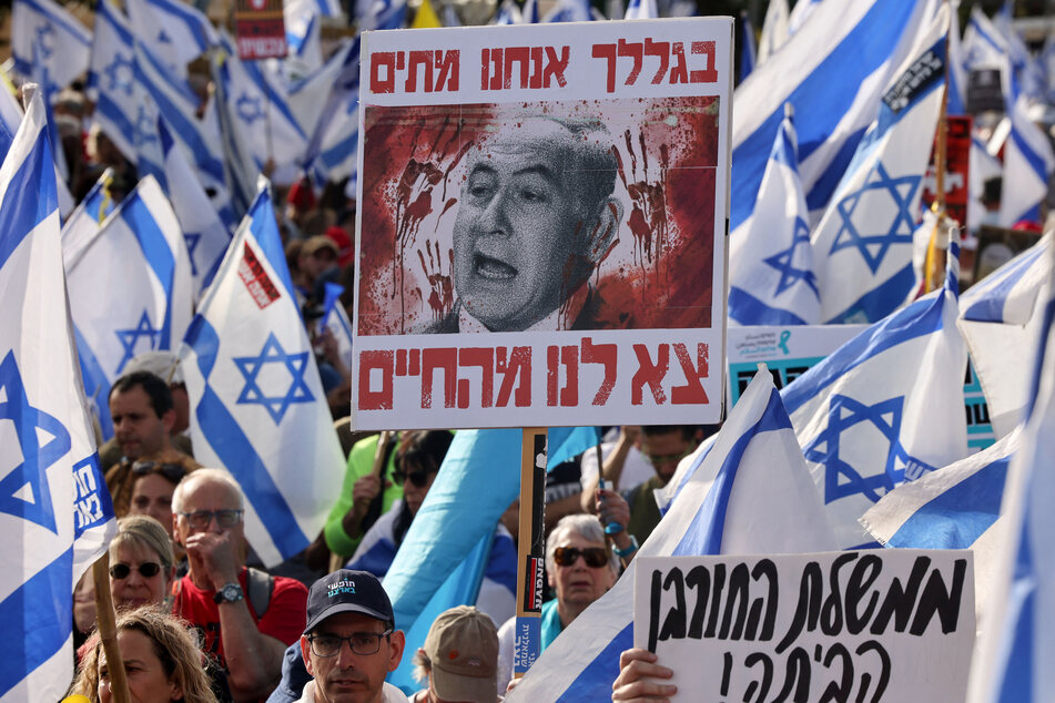 Israelis protest against Prime Minister Benjamin Netanyahu's government in front of the Israeli parliament, the Knesset, in Jerusalem on May 20, 2024.