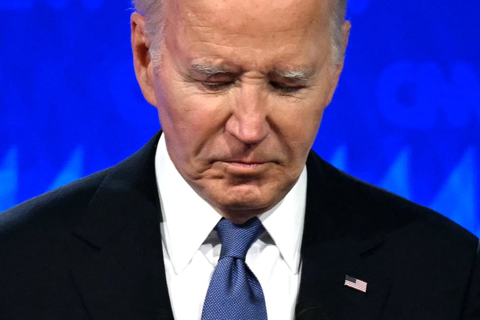President Joe Biden looks down as he participates in the first presidential debate of the 2024 elections with former US President and Republican presidential candidate Donald Trump at CNN's studios in Atlanta, Georgia, on Thursday.