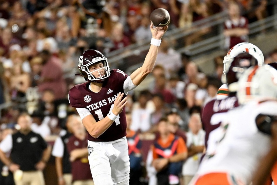 Max Johnson of the Texas A&amp;M Aggies throws a pass against the Miami Hurricanes during the second quarter of the game at Kyle Field.