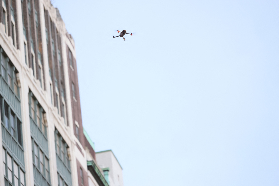 An NYPD drone hovers over Pro-Palestine activists as they march and participate in a Global Strike for Gaza on December 18, 2023 in New York City, New York.