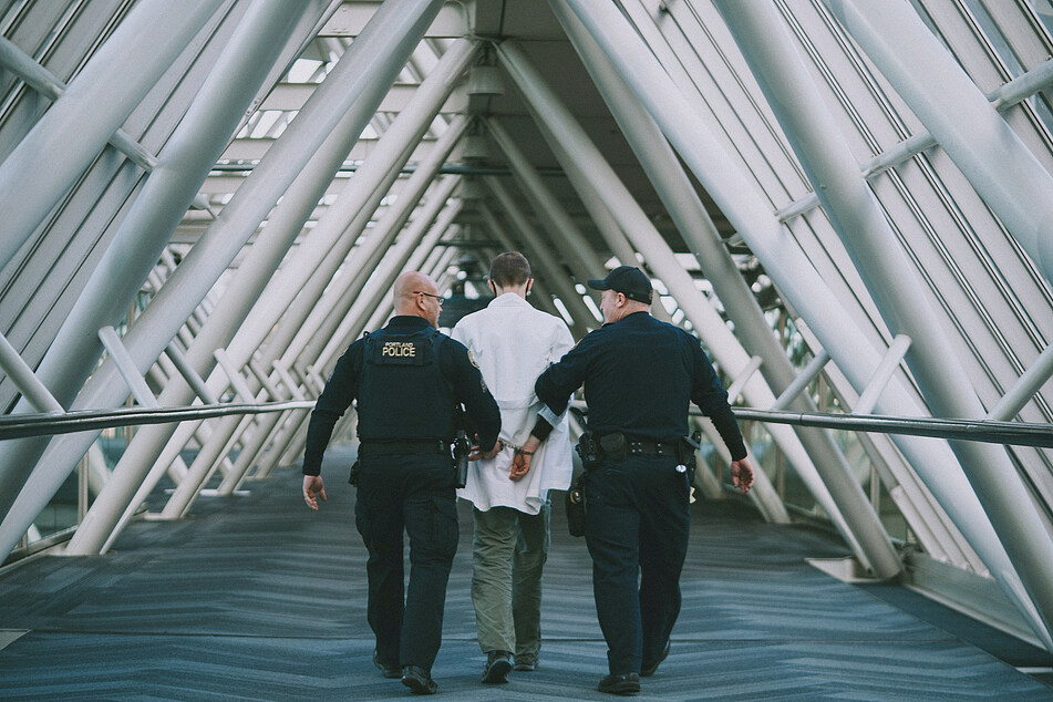 A Scientist Rebellion protester is arrested by police in Portland Oregon.