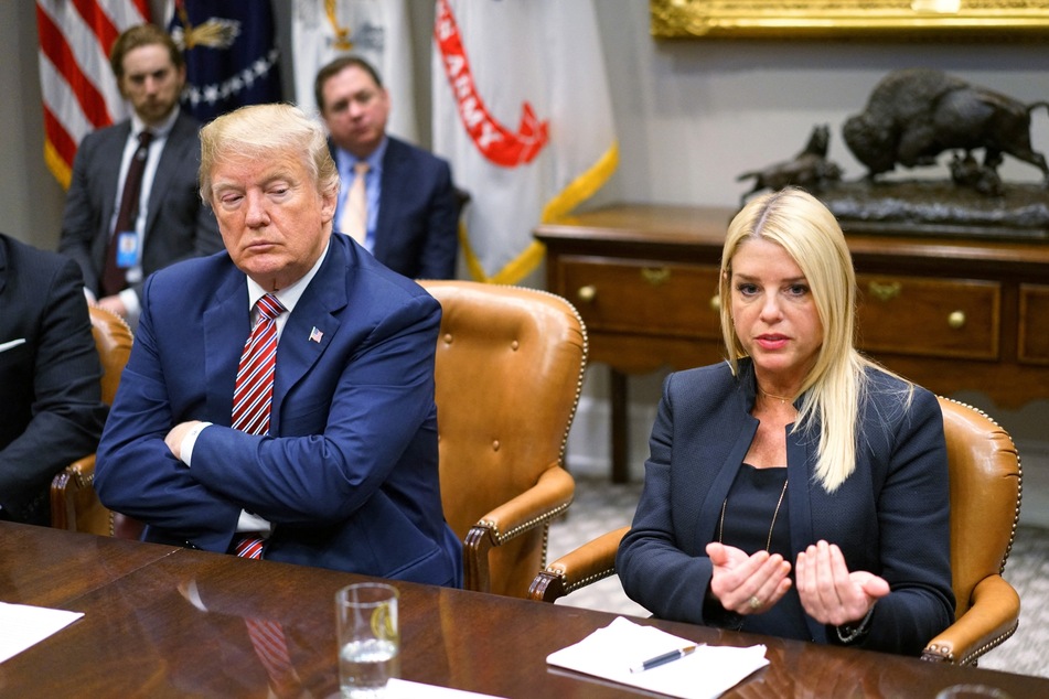 President Donald Trump (L) and Florida Attorney General Pam Bondi speaking during a meeting with on school safety at the White House on February 22, 2018.