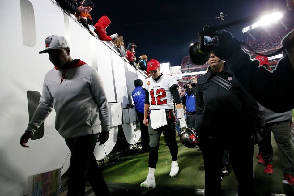 Brady walking off the football field for possibly the last time after the Bucs' playoff defeat to the Rams.