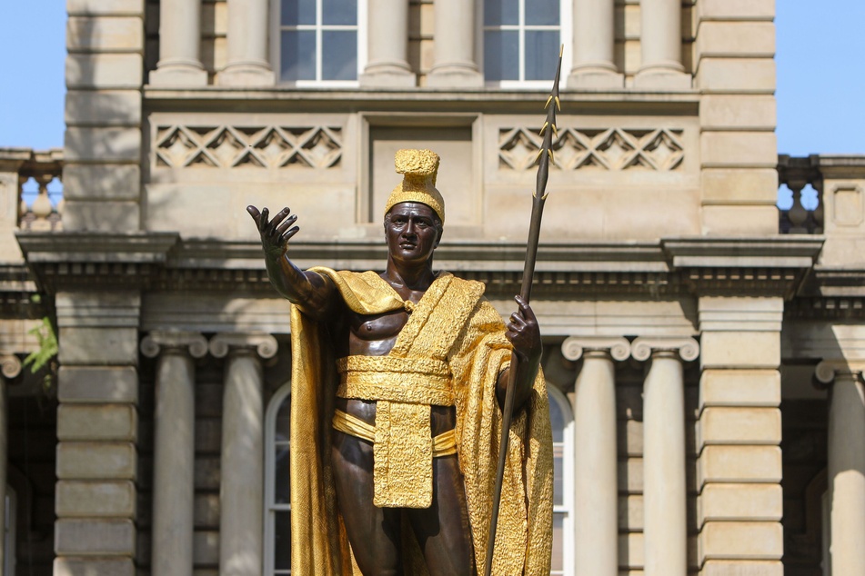 A statue of King Kamehameha I stands outside Aliʻiōlani Hale in Honolulu, the Hawaiian Kingdom's former seat of government initially designed as a palace for Kamehameha V. The historic building now houses the State Supreme Court.