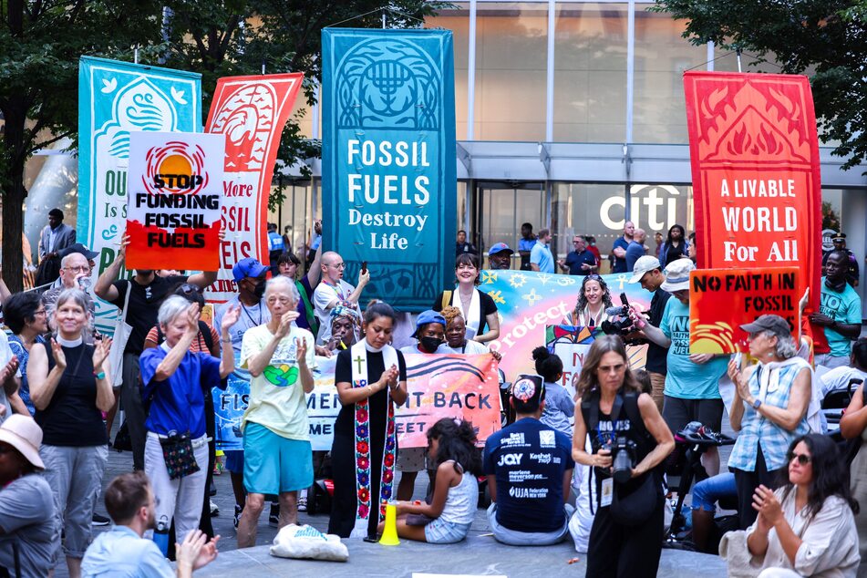 Gatherers protest Citigroup's investment in fossil fuels in front of Citibank headquarters in New York on August 1, 2024.