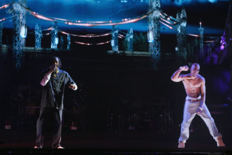 Rappers have continued to pay tribute to Tupac over the years, like Snoop Dogg (pictured l.), who performed with a hologram of the deceased rapper at Coachella in 2012.