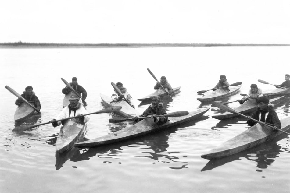 Indigenous Alaskans pilot canoes in Noatak, Alaska, circa 1929.