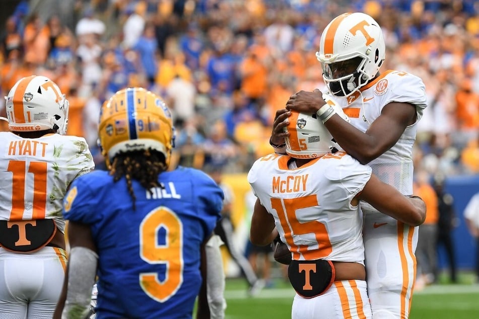 Bru McCoy of the Tennessee Volunteers celebrates with Hendon Hooker of the Tennessee Volunteers after making a catch for a 32-yard touchdown reception in the second quarter during the game against the Pittsburgh Panthers.