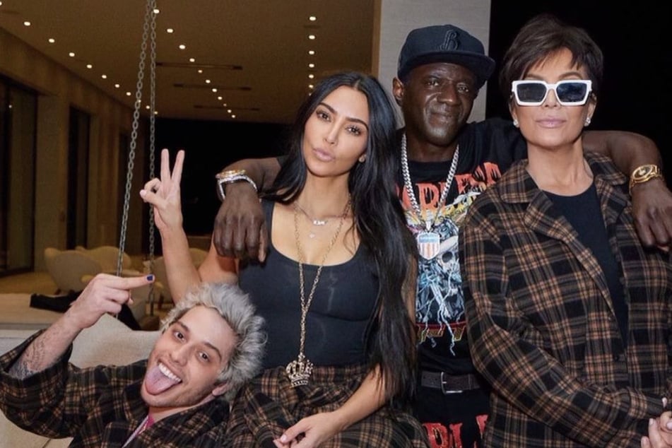 On Wednesday, Flavor Flav (c.) shared a pic from Pete Davidson's (l.) 28th birthday party thrown by Kim Kardashian (l.) at Kris Jenner's (r.) home.