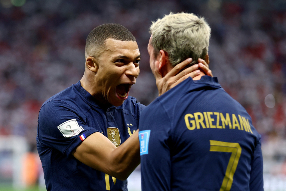 France's Kylian Mbappe celebrates their second goal with Antoine Griezmann.