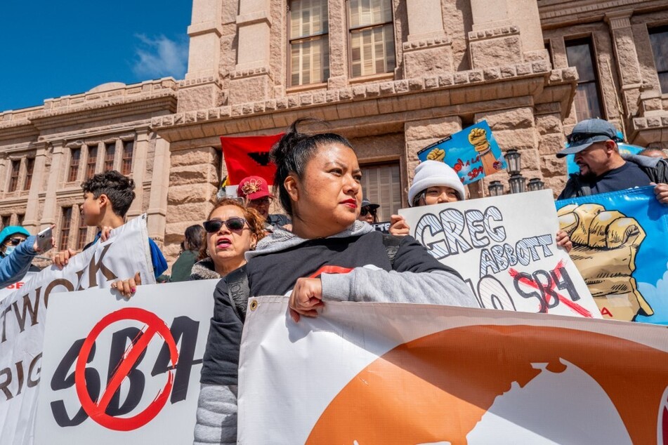 Immigrants' rights activists protest Texas' Senate Bill 4 – currently on pause – in front of the state Capitol in Austin.