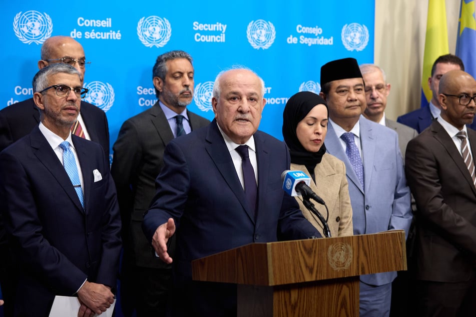 Riyad Mansour, permanent observer of the State of Palestine to the United Nations, speaks to reporters with representatives of the Arab Group and the Organization of Islamic Cooperation during a Security Council stakeout at the UN headquarters in New York on June 4, 2026.