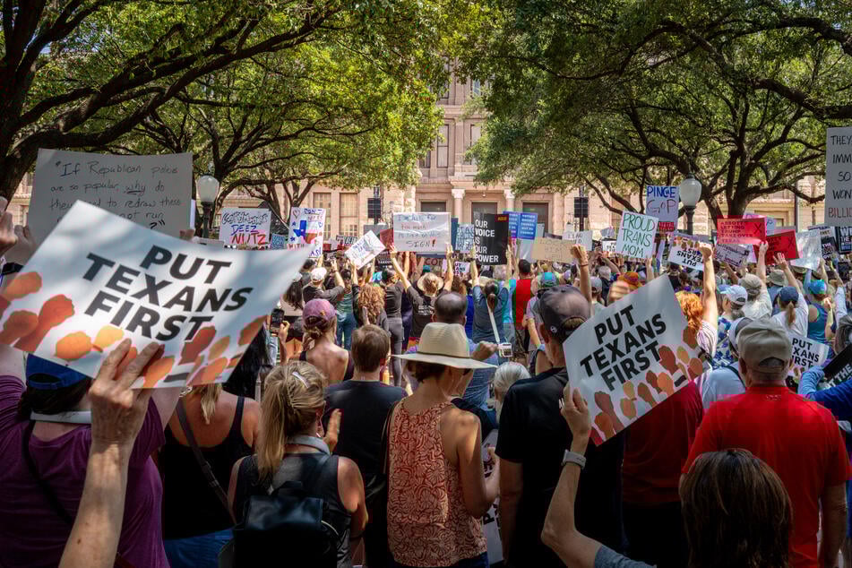 People rally during the "Stop the Trump Takeover" demonstration outside of the Texas State Capitol in Austin on August 16, 2025.