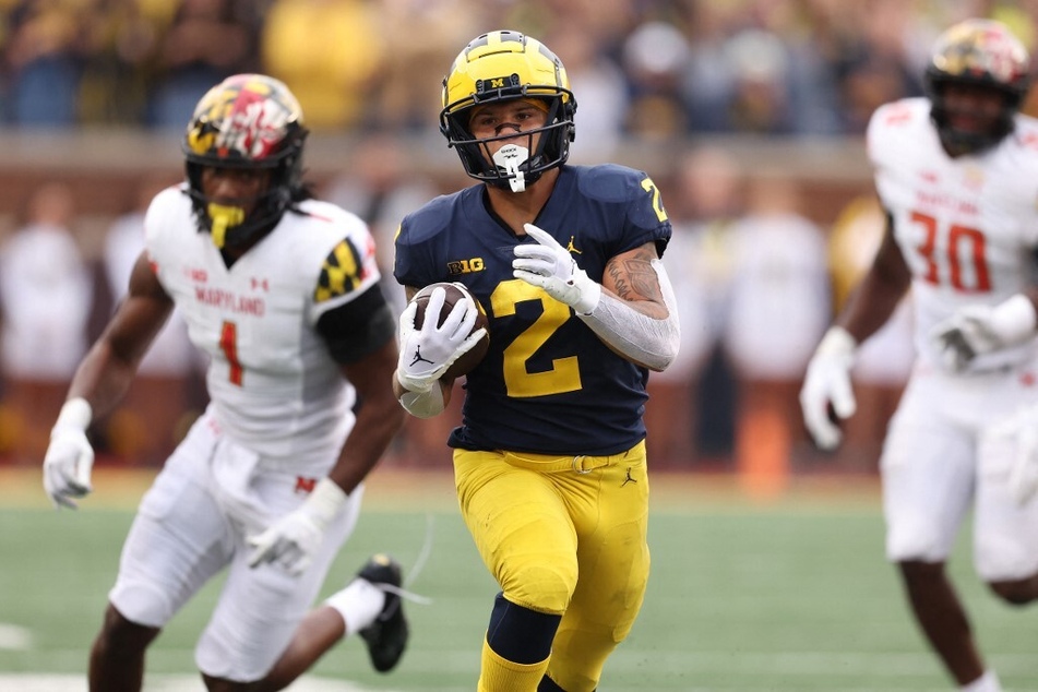Entering the eighth week of the season, Michigan's Blake Corum (c.) currently leads the nation with the most rushing scores of all players in college football – with 13 touchdowns.
