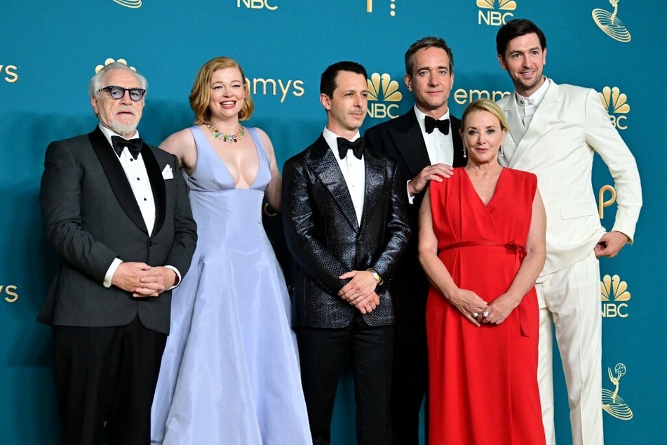Actors Brian Cox, Sarah Snook, Jeremy Strong, Matthew Macfayden, J. Smith-Cameron, and Nicholas Braun pose after winning the Emmy for Outstanding Drama Series for Succession during the 74th Emmy Awards in September 2022.