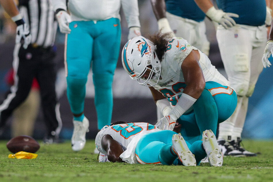 Miami Dolphins wide receiver Daewood Davis lays on the ground after being hit in the fourth quarter against the Jacksonville Jaguars at EverBank Stadium.