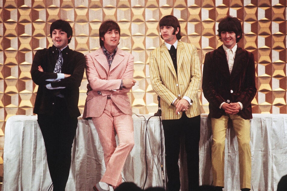 This photo taken on June 29, 1966 shows members of the British band The Beatles, (L to R) Paul McCartney, John Lennon, Ringo Starr, and George Harrison, holding a press conference in Tokyo at the start of their tour.