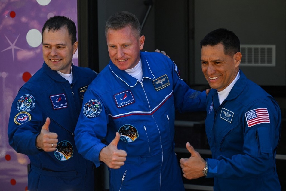 NASA astronaut Frank Rubio (r.) and Russian cosmonauts Sergey Prokopyev (c.) and Dmitri Petelin, members of the International Space Station (ISS) Expedition 68 main crew, pose together before pre-launch preparations.