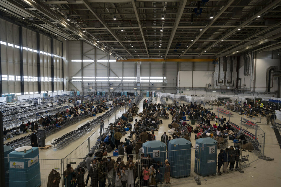 Evacuees from Afghanistan prepare to leave the Ramstein Air Base in Germany.