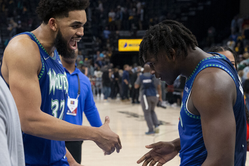 Karl-Anthony Towns (l.) and Anthony Edwards celebrate during the Timberwolves' win over the Grizzlies.