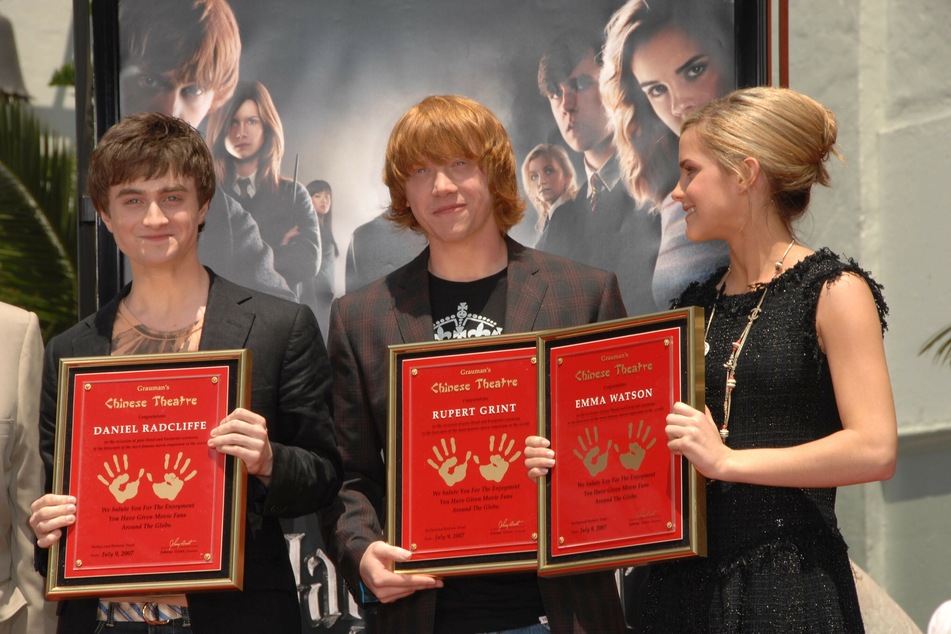 Daniel Radcliffe (left), Rupert Grint (center) and Emma Watson at an induction ceremony hosted by Grauman's Chinese Theater in LA.