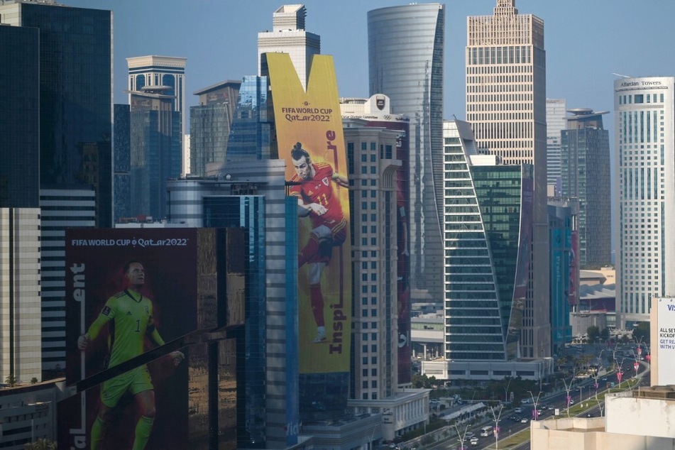 Banner depicting world soccer stars hang alongside buildings in Doha ahead of the Qatar 2022 FIFA World Cup.