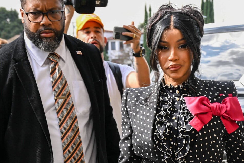 Cardi B throws pen at paparazzi over pregnancy questions: "Stop disrespecting me"
