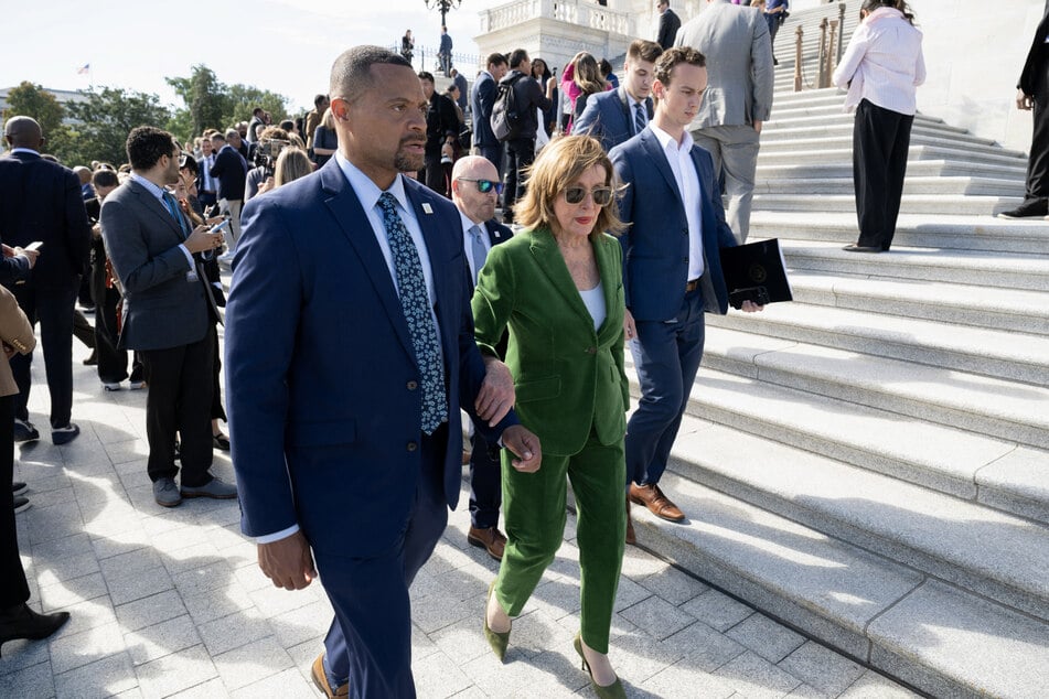 Former House Speaker Nancy Pelosi confronted a reporter working for a far-right network in a tense moment caught on camera.