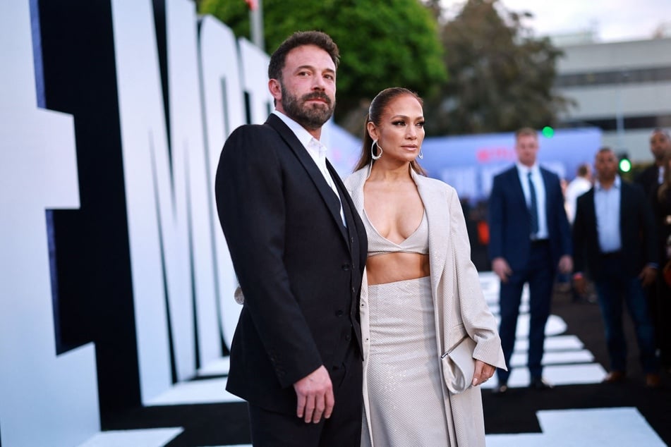 Ben Affleck (l.) hits back at fans' claims that he's "sad" in his viral pics amid talk he's separated from J.Lo.