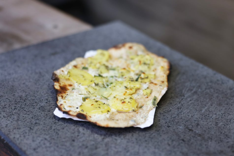 Hauchdünn und kross gebacken: So muss für viele der perfekte Flammkuchen schmecken.