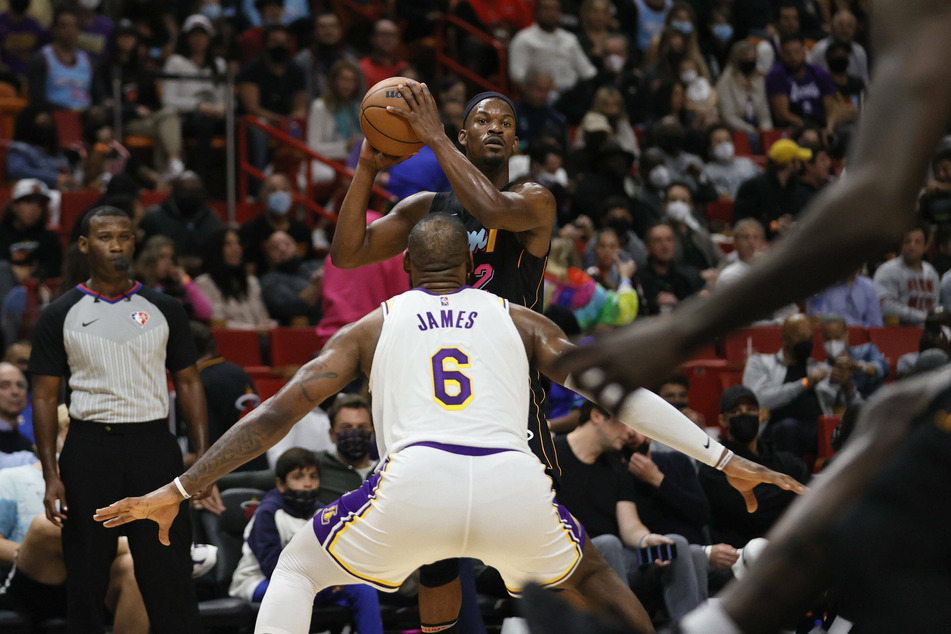 LeBron James defending Miami Heat forward Jimmy Butler in the Lakers' loss.