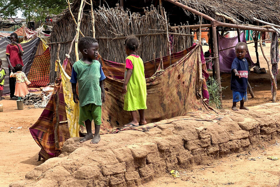 Displaced Sudanese children stand at the Zamzam camp in North Darfur.